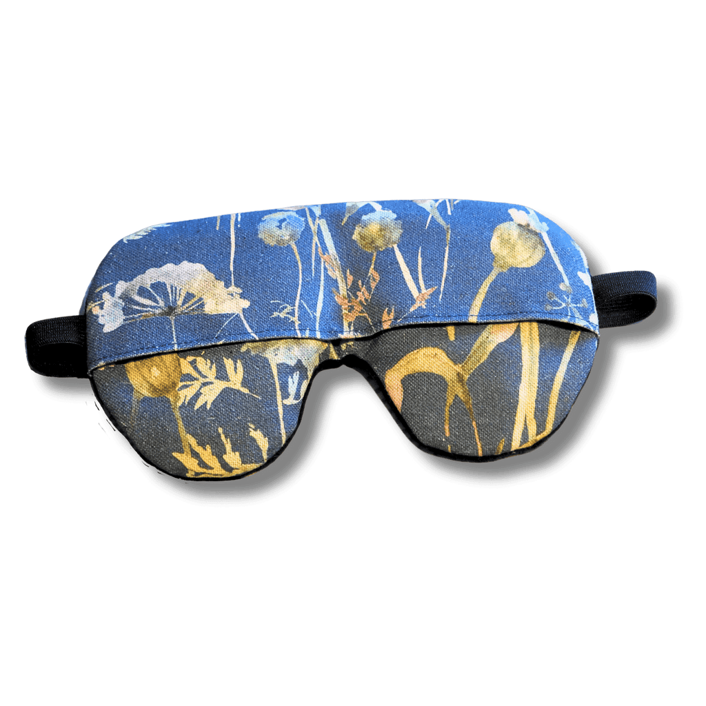 Weighted eye mask with a blue floral design on a transparent background