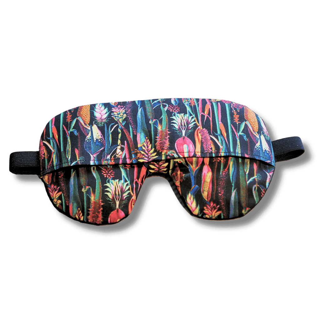 Weighted eye mask with a black floral design on a transparent background