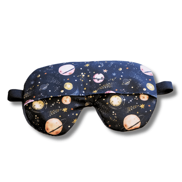 Weighted eye mask with a galaxy design on a transparent background