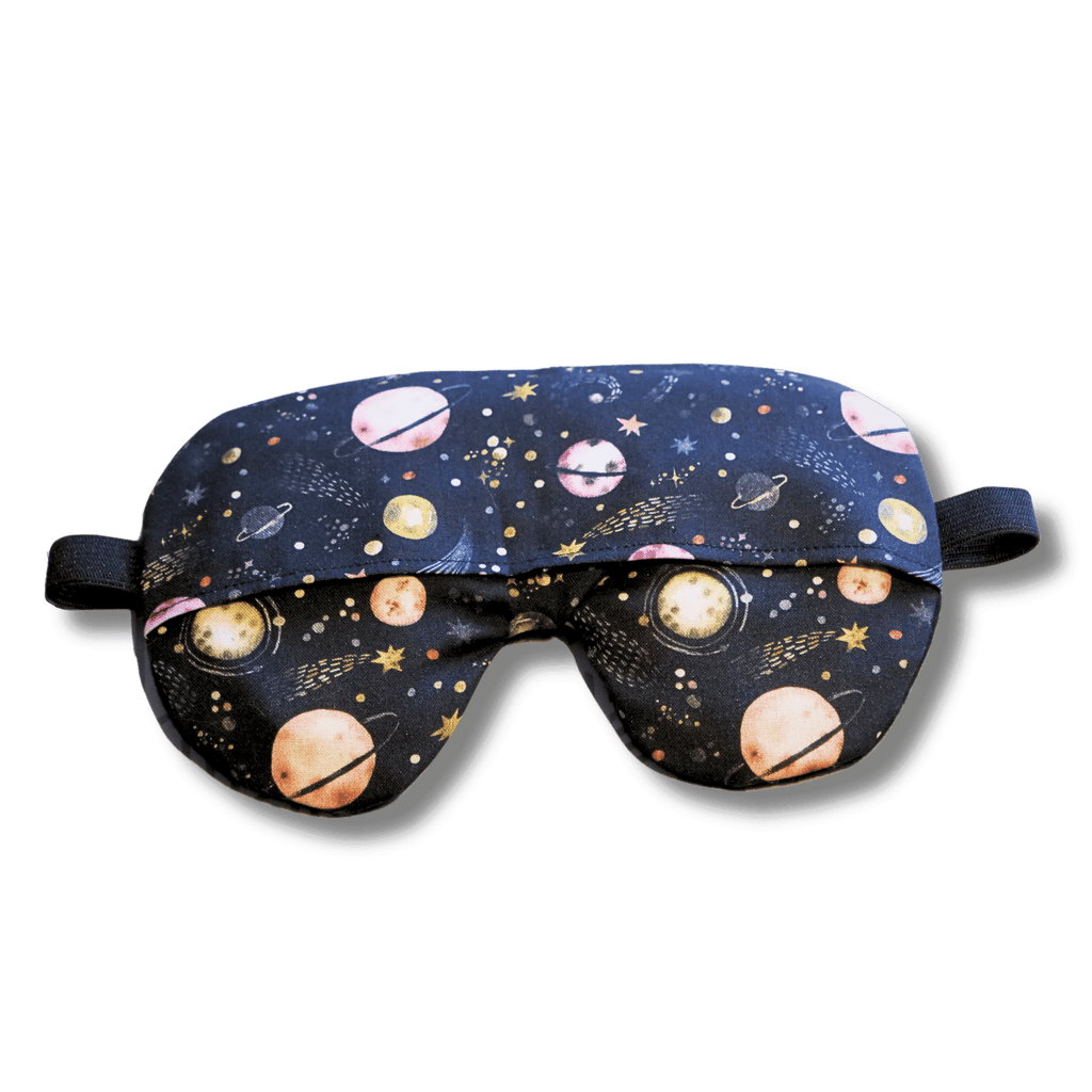 Weighted eye mask with a galaxy design on a transparent background