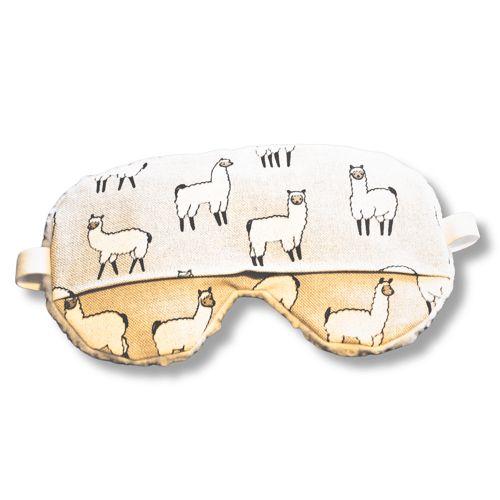 Weighted eye mask with a llama design on a transparent background