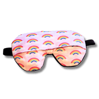 Weighted eye mask with a pink rainbow design on a transparent background