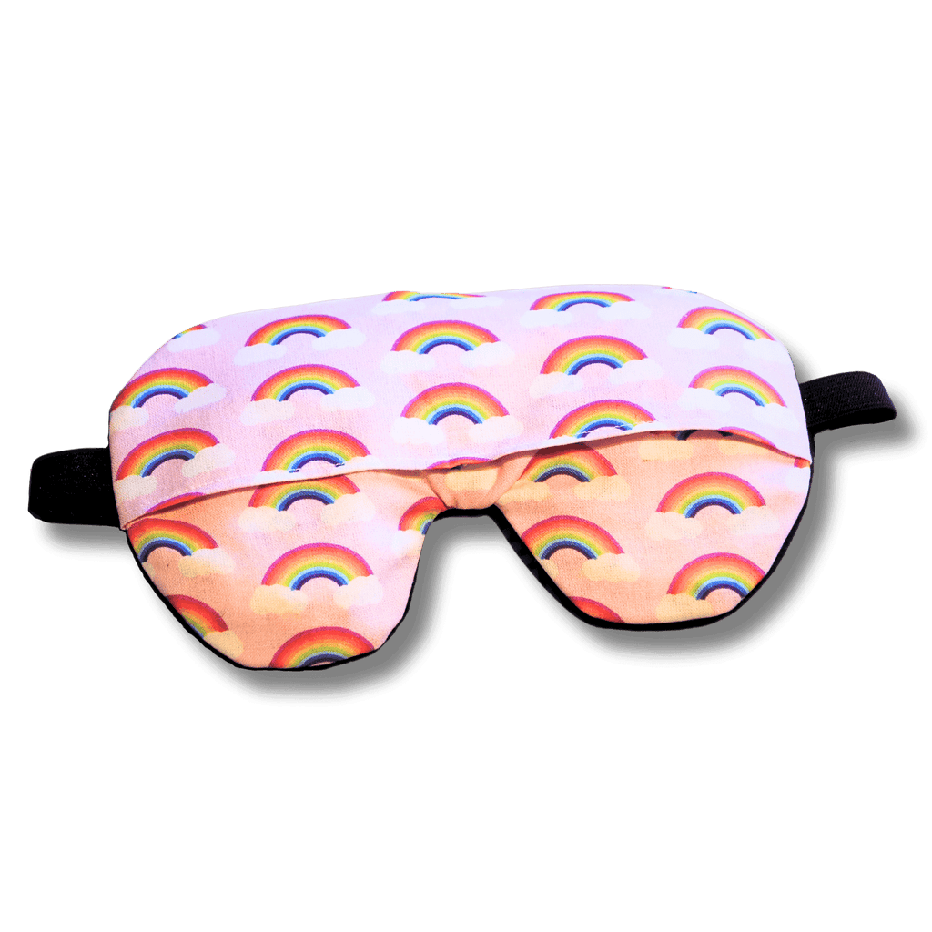Weighted eye mask with a pink rainbow design on a transparent background