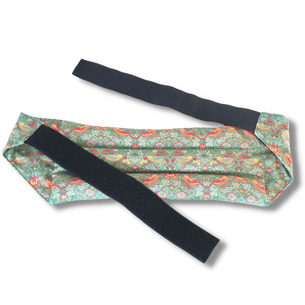 Wearable microwave wheat bag belt with a green bird design on a transparent background