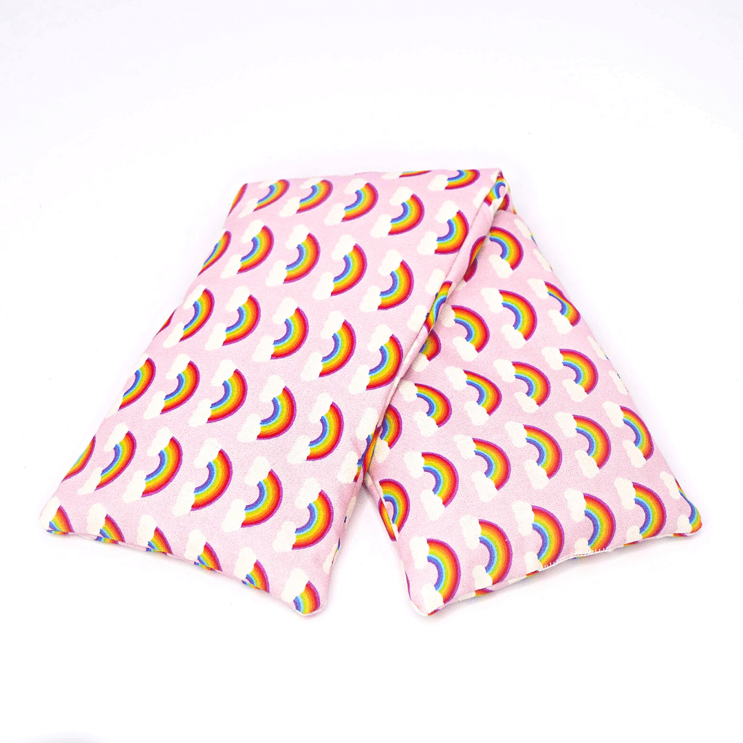 Folded wheat bag with pink rainbow design