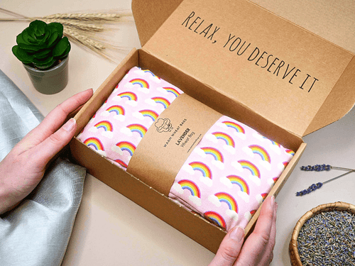Microwave Wheat Bag with a rainbow pink design in a gift box