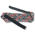 Wearable microwave wheat bag belt with a black floral design on a transparent background