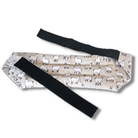 Wearable microwave wheat bag belt with a llama design on a transparent background