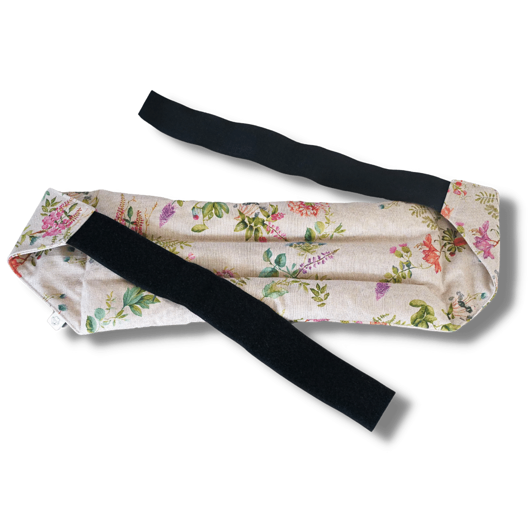 Wearable microwave wheat bag belt with a floral design on a transparent background