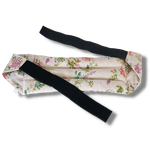 Wearable microwave wheat bag belt with a floral design on a transparent background